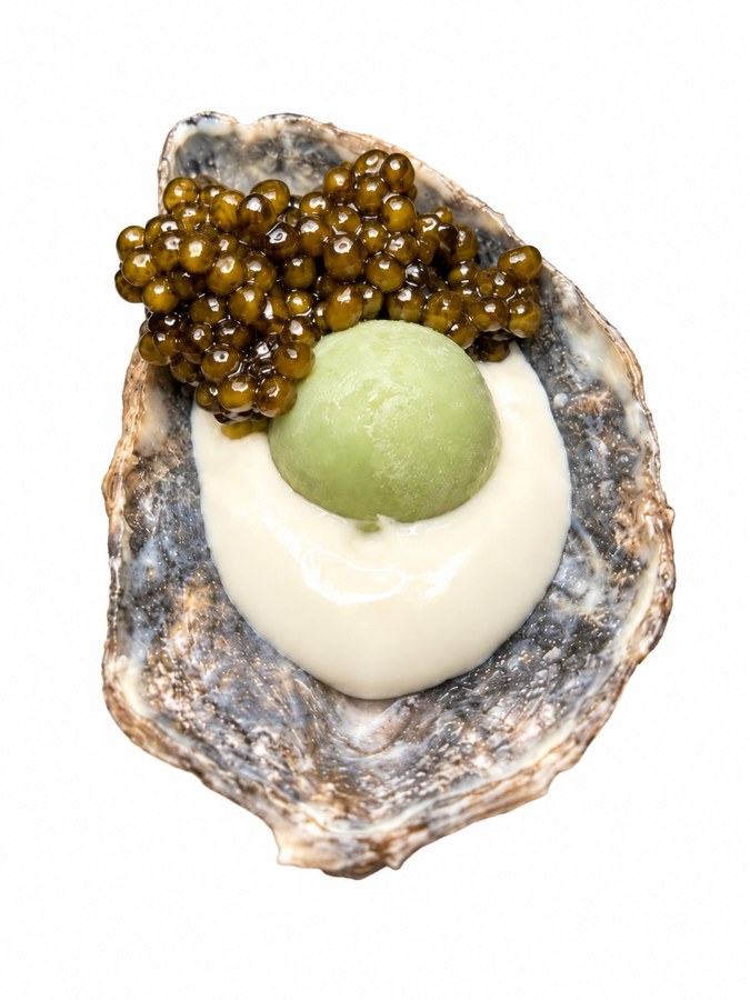 Edible oyster shell with crab pearl